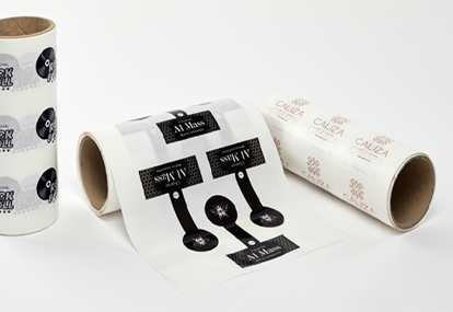 Roll of self-adhesive labels on transparent vinyl